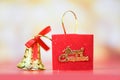 Christmas decoration red ribbon bell with light gold abstract holiday background / christmas festive xmas winter and Happy New Royalty Free Stock Photo