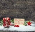 Christmas decoration red stars and antique baby shoes in snow Royalty Free Stock Photo