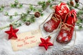 Christmas decoration red stars and antique baby shoes Royalty Free Stock Photo