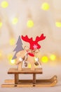 Christmas decoration with rein deer over christmas blurry lights background Royalty Free Stock Photo
