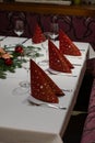 Christmas decoration on a restaurant table. wine glass, red napkins;