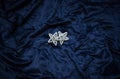 Christmas decoration on royal blue background. Top view on stars wings and ornaments.