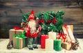 Christmas decoration Santa Claus, gift boxes, burning candles. V Royalty Free Stock Photo