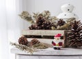 Christmas decoration of santa claus and pine cones on wooden cab Royalty Free Stock Photo
