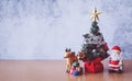 Christmas decoration - Santa Clause, tree and gift on wooden table. Christmas and Happy new year concept Royalty Free Stock Photo