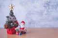 Christmas decoration - Santa Clause, tree and gift on wooden table. Christmas and Happy new year concept Royalty Free Stock Photo