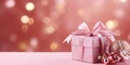 Christmas decoration set with gift boxes and sparkling lights on pink background, copy space Royalty Free Stock Photo