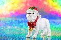 Christmas decoration in a shape of dog on rainbow blurred background with copy space.