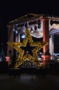 Christmas decoration in the shape of a star on the street Royalty Free Stock Photo
