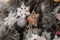 Christmas decoration in the shape of a star on a Christmas tree Royalty Free Stock Photo