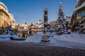 Christmas decoration. Ski resort in Canada. Snow-covered buildings, totem, trees Royalty Free Stock Photo