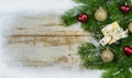 Christmas background with snow frame, fir tree branches, gift and decorations Royalty Free Stock Photo