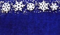 Christmas decoration.Snowflakes border on blue background with copyspace. Royalty Free Stock Photo
