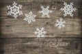 Christmas decoration snowflakes on rustic wooden background Royalty Free Stock Photo