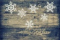 Christmas decoration snowflakes on wooden background Royalty Free Stock Photo