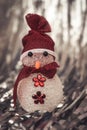 Christmas Decoration snowman on shiny silver christmas paper close up. Art Christmas Greeting Card Royalty Free Stock Photo