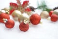 Christmas decoration. Christmas spruce with ball and blurred shiny lights. Christmas composition is with colorful balls on snow. C