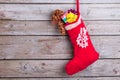 Christmas decoration stocking with toy and gifts. Royalty Free Stock Photo