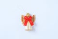 Christmas decoration straw angel with red bow on a white background Royalty Free Stock Photo