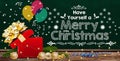 Christmas decoration with surprise gift box and chalkboard Merry Christmas message