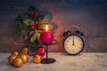 Christmas decoration on table with burning red candle