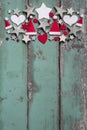 Christmas decoration at top on shabby green wooden background for a frame
