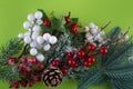 Christmas decoration. Top view on green pine tree branch, cone, red, white winter berries. Happy new year concept Royalty Free Stock Photo