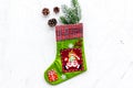 Christmas decoration. Traditional festive socks with spruce branch and pine cones on white background top view space for Royalty Free Stock Photo