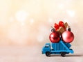 Christmas decoration. Truck car carries decorations for Christmas trees. Christmas ball Royalty Free Stock Photo