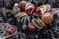 Christmas decoration. Twigs christmas tree, brown natural pine cones and variety of fruits on burlap fabric background