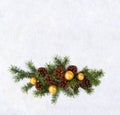 Christmas decoration. Twigs christmas tree, brown natural pine cones and yellow christmas balls on snow with space for text