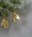 Christmas decoration two golden angel on spruce tree branch Royalty Free Stock Photo
