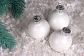 Christmas decoration with white chrismas ball snow and fir branches. Royalty Free Stock Photo