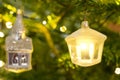 A Christmas decoration hanging in a Nordman christmastree close up