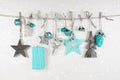 Christmas decoration in white an light blue on wooden background Royalty Free Stock Photo