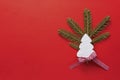 Christmas Decoration with White Wooden Christmas Tree on Red Background. Copy Space Wallpaper. Royalty Free Stock Photo