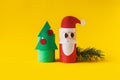 Christmas decoration for winter season. Holiday easy DIY craft idea for kids. Toilet paper roll tube toy. Santa snowman Royalty Free Stock Photo