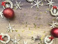 Christmas decoration on wooden background. Copy space. Golden christmas decor, red balls, straw stars. Christmas concept Royalty Free Stock Photo