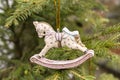 Christmas decoration. Wooden paited horse on the christmas tree. Royalty Free Stock Photo