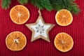 Christmas decoration with wooden star on red wool fabric. Christmas rustic still life Royalty Free Stock Photo