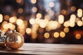 Christmas decoration on wooden table in front of bokeh lights background Royalty Free Stock Photo