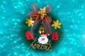 Christmas decoration with christmas wreath. Blue background