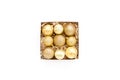 Christmas decoration: yellow glass christmas balls on white background. flat lay, top view