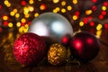 Christmas decorations against blurred background and out of focus lights. Close up of glittery Christmas balls