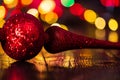 Christmas decorations against blurred background and out of focus lights. Close up of glittery Christmas balls