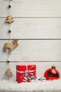 Christmas decorations against wooden wall Royalty Free Stock Photo