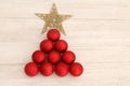 Christmas decorations arranged in tree shape. Royalty Free Stock Photo