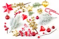 Christmas decorations background. Red star, holly berries, gold gift and green fir branch on white background. Xmas composition Royalty Free Stock Photo