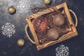 Christmas decorations Balls beads snowflakes in a wooden box on a rustic dark background. Top view, place for text Royalty Free Stock Photo