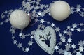 Christmas decorations balls white, silver stars, hart blue background Royalty Free Stock Photo